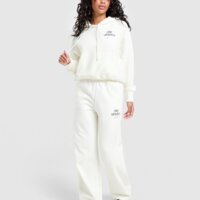 Spodnie damskie NIKE SPODNIE W NK PHNX FLC HR PANT WD GLS io1297-133 kolor beżowy