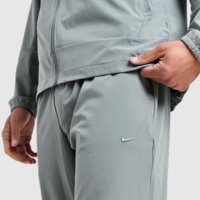 Spodnie męskie NIKE SPODNIE M NK DF UNLIMITED PANT TPR fb7548-084 kolor szary