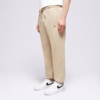 Spodnie męskie NEW BALANCE SPODNIE ATHLETICS FRENCH TERRY JOGGER mp41508sot kolor beżowy