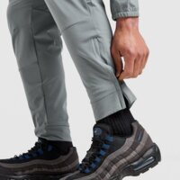 Spodnie męskie NIKE SPODNIE M NK DF UNLIMITED PANT TPR fb7548-084 kolor szary
