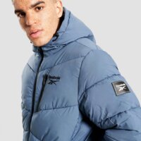 Męska kurtka zimowa REEBOK KURTKA ZIMOWA STRETCH PUFFER JACKET omrb1567_mineral blu kolor granatowy